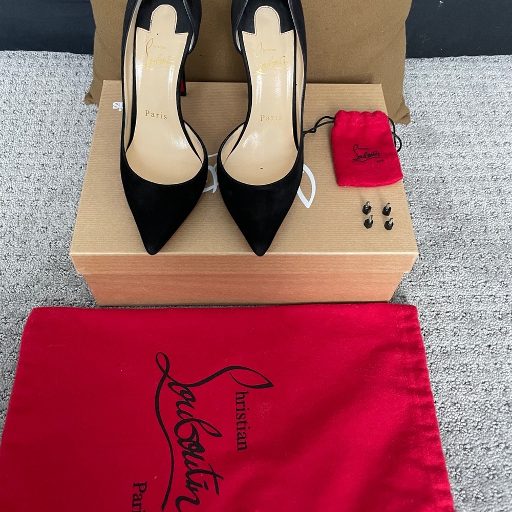 Christian Louboutin's half d'Orsay Iriza pump in black suede